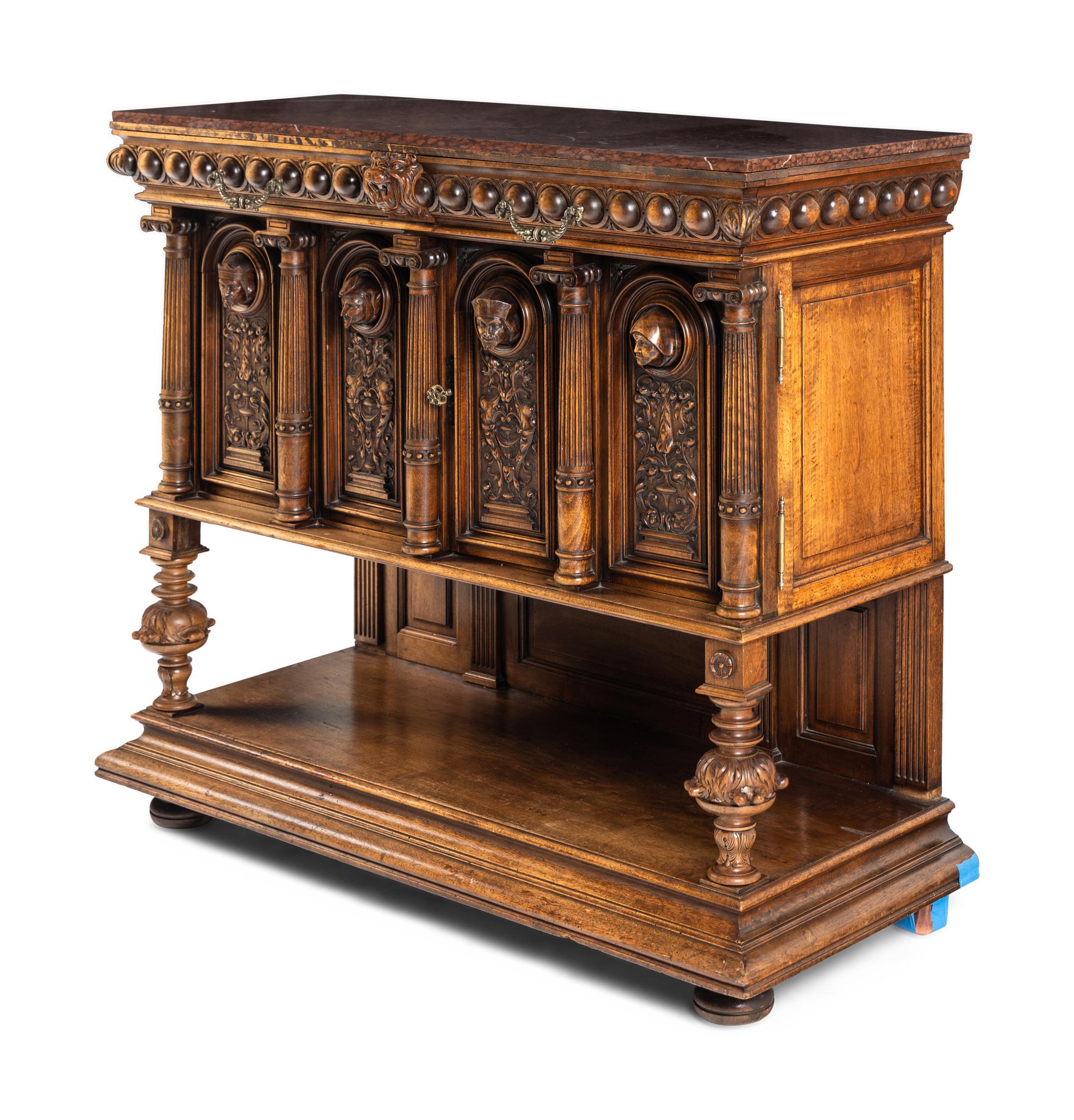 A Renaissance Revival Carved Walnut Marble-Top Cabinet