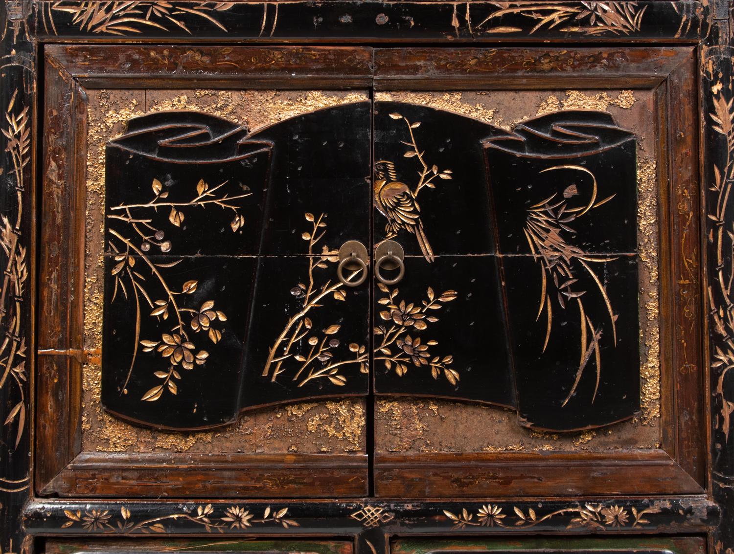 A Chinese Export Cabinet with Carved Lacquer Decoration