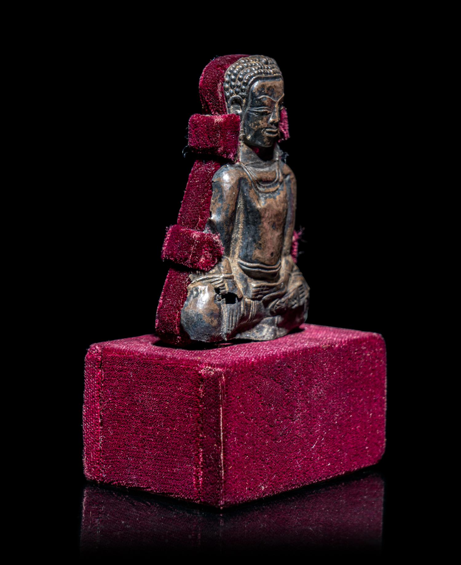 A Thai Silvered Metal Repoussé Plaque of Buddha