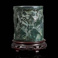A Chinese carved dark green hardstone brushpot with marble-inlaid wood stand