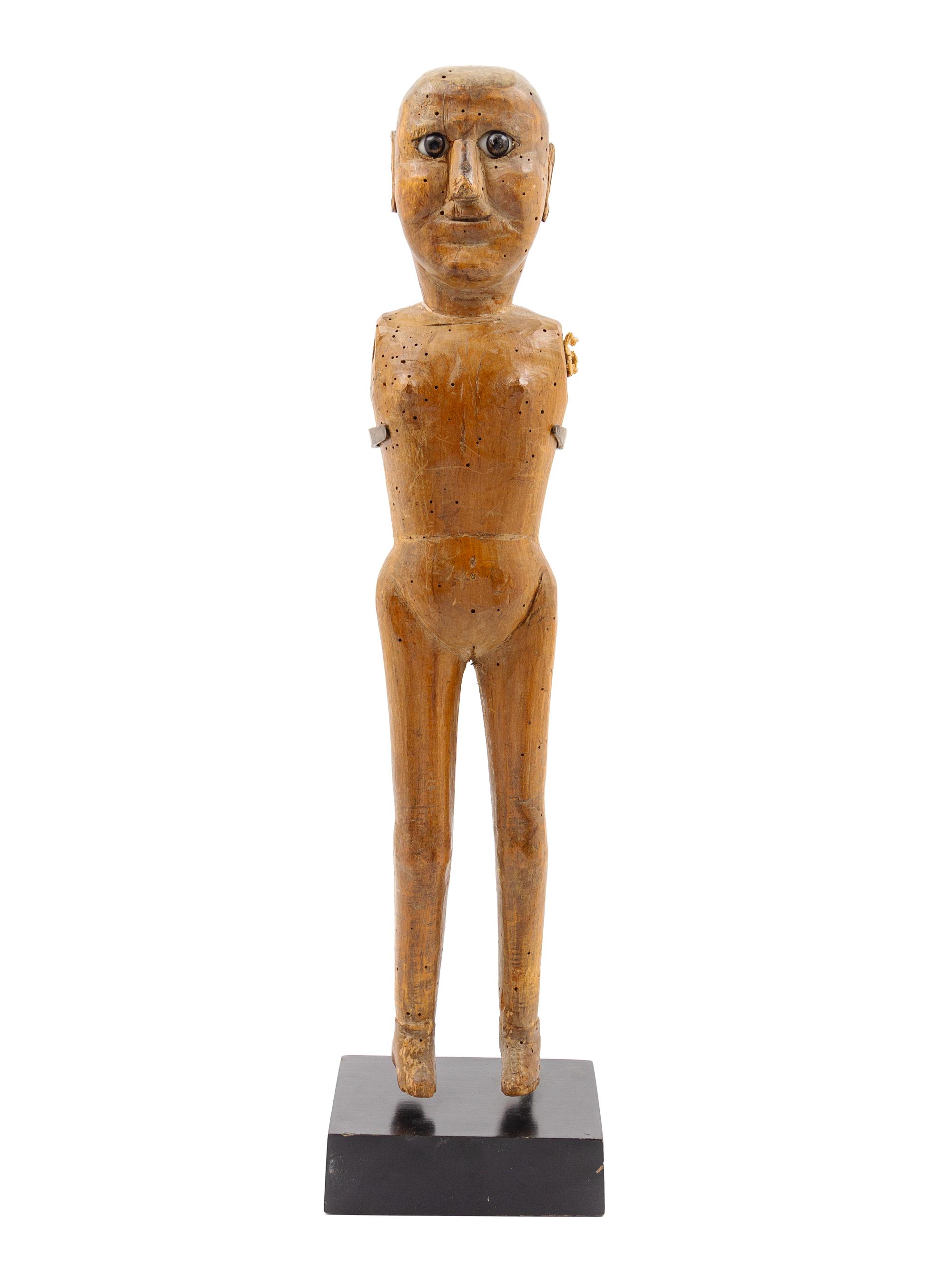 A Carved Wood Figure