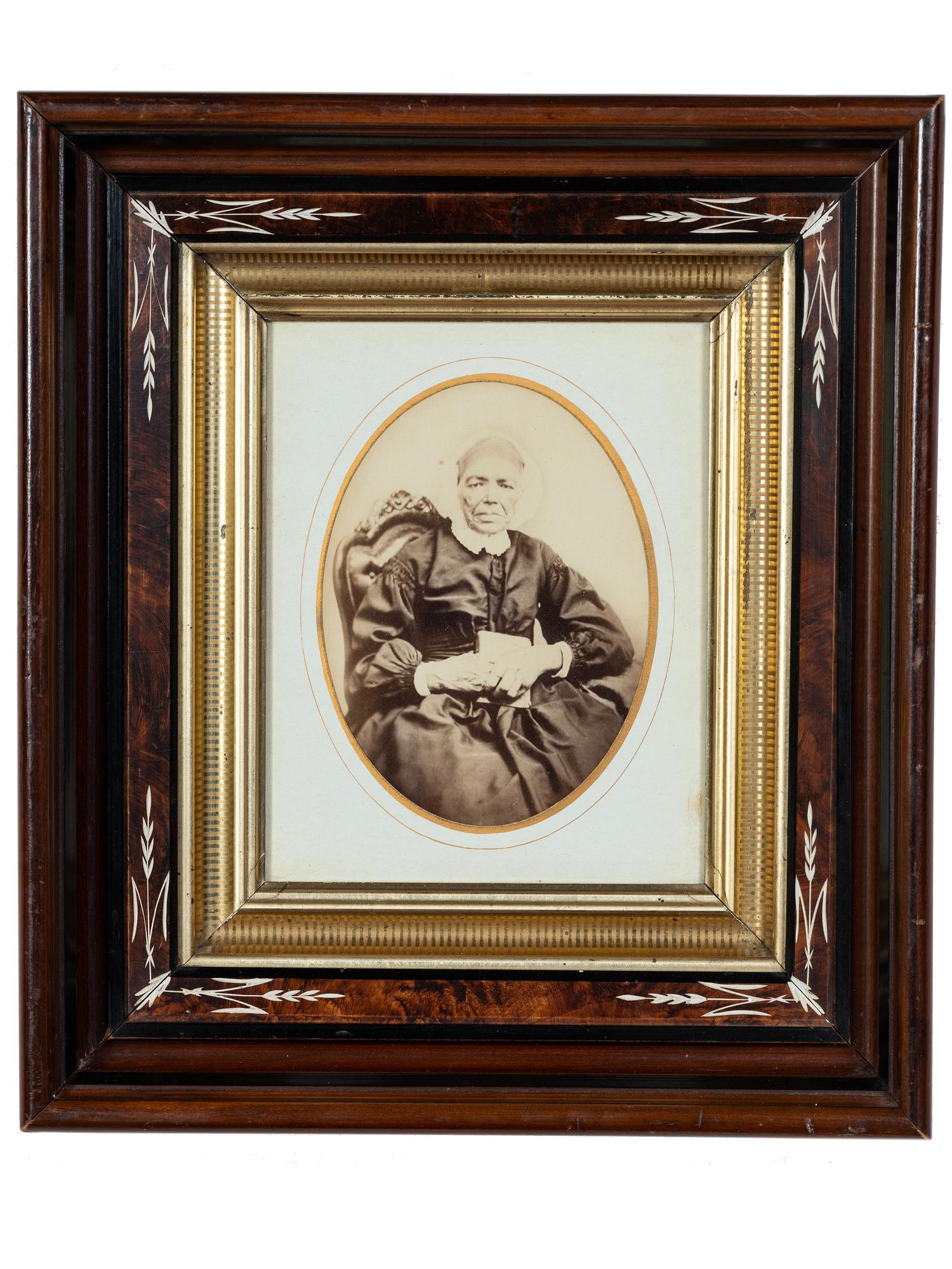 [EARLY PHOTOGRAPHY]. Albumen photograph of African American woman and tintype of white man found together in Louisiana. Ca mid 19th century.
