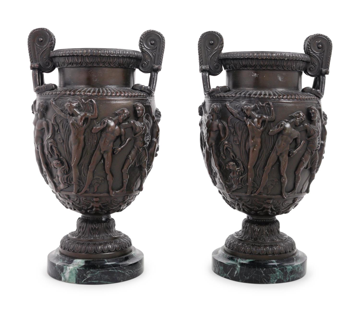 A Pair of Grand Tour Cast Metal and Marble Urns