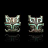 A Pair of Chinese Turquoise and Glass Inset Bronze Beast Mask Harness Ornaments, Late Western Zhou Dynasty-Warring States Period 西周晚期-戰國 青銅嵌松石饕餮紋马饰一對