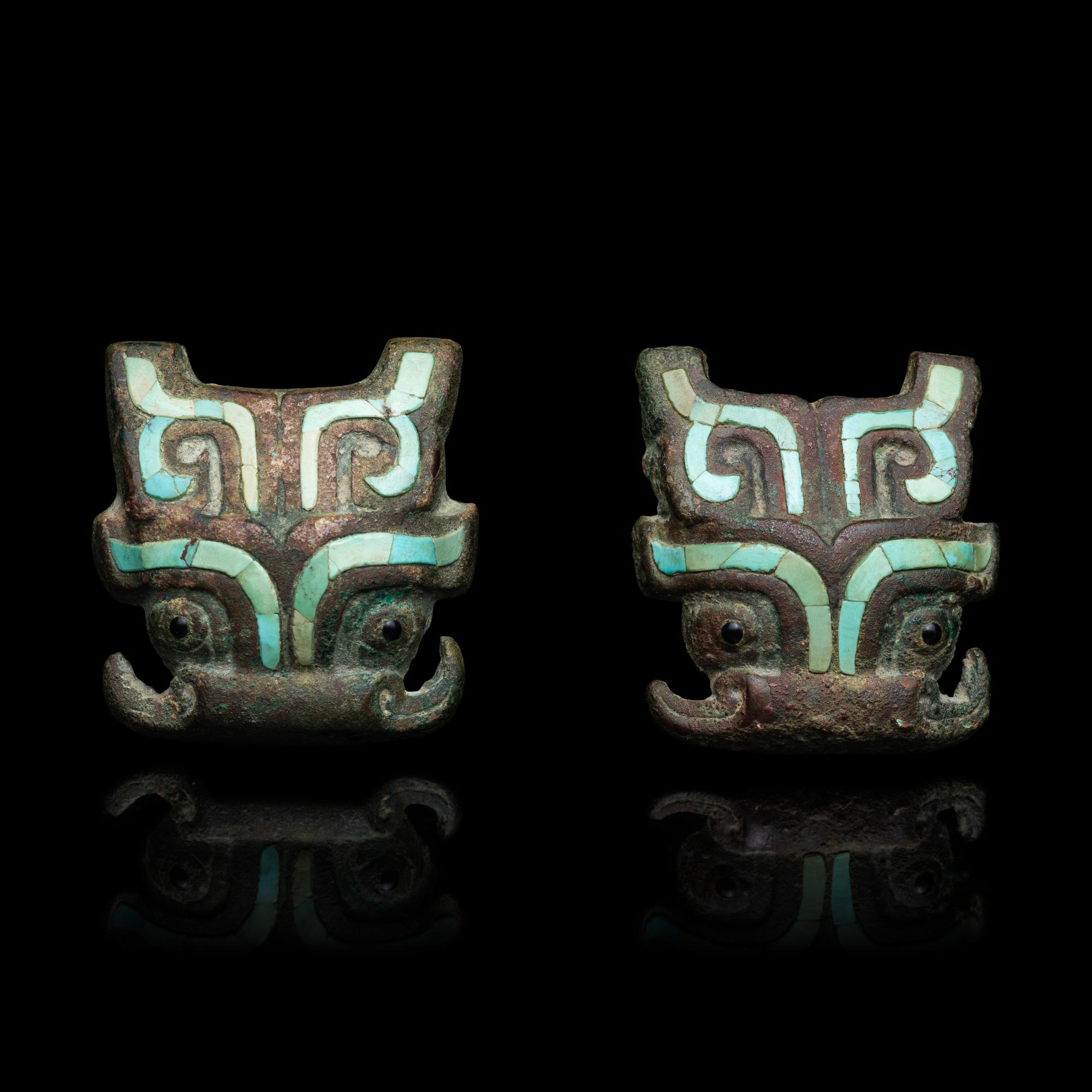 A Pair of Chinese Turquoise and Glass Inset Bronze Beast Mask Harness Ornaments, Late Western Zhou Dynasty-Warring States Period 西周晚期-戰國 青銅嵌松石饕餮紋马饰一對