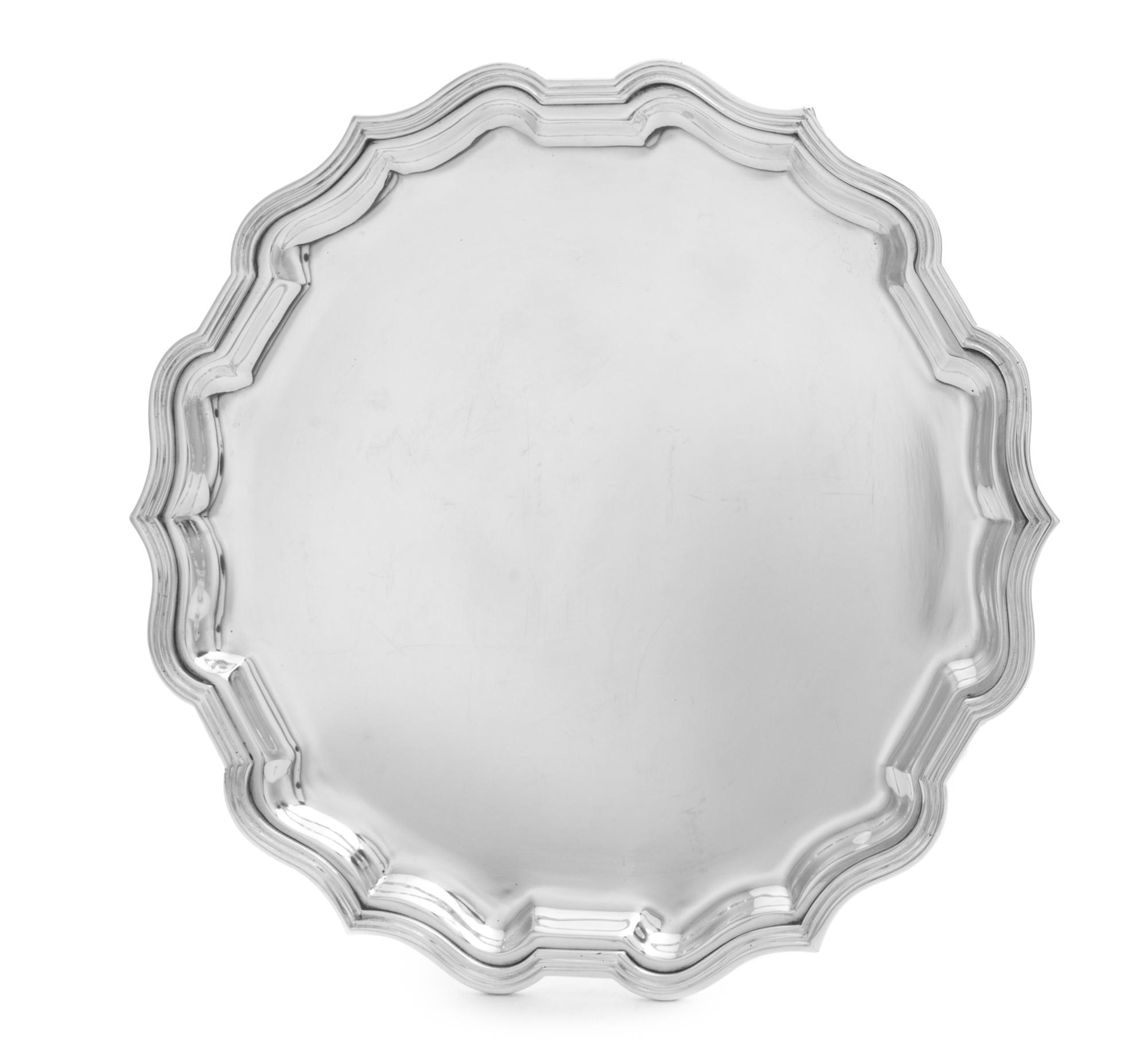 An Italian Silver Circular Tray, Parenti, Florence, having a scalloped edge and raised on three feet.