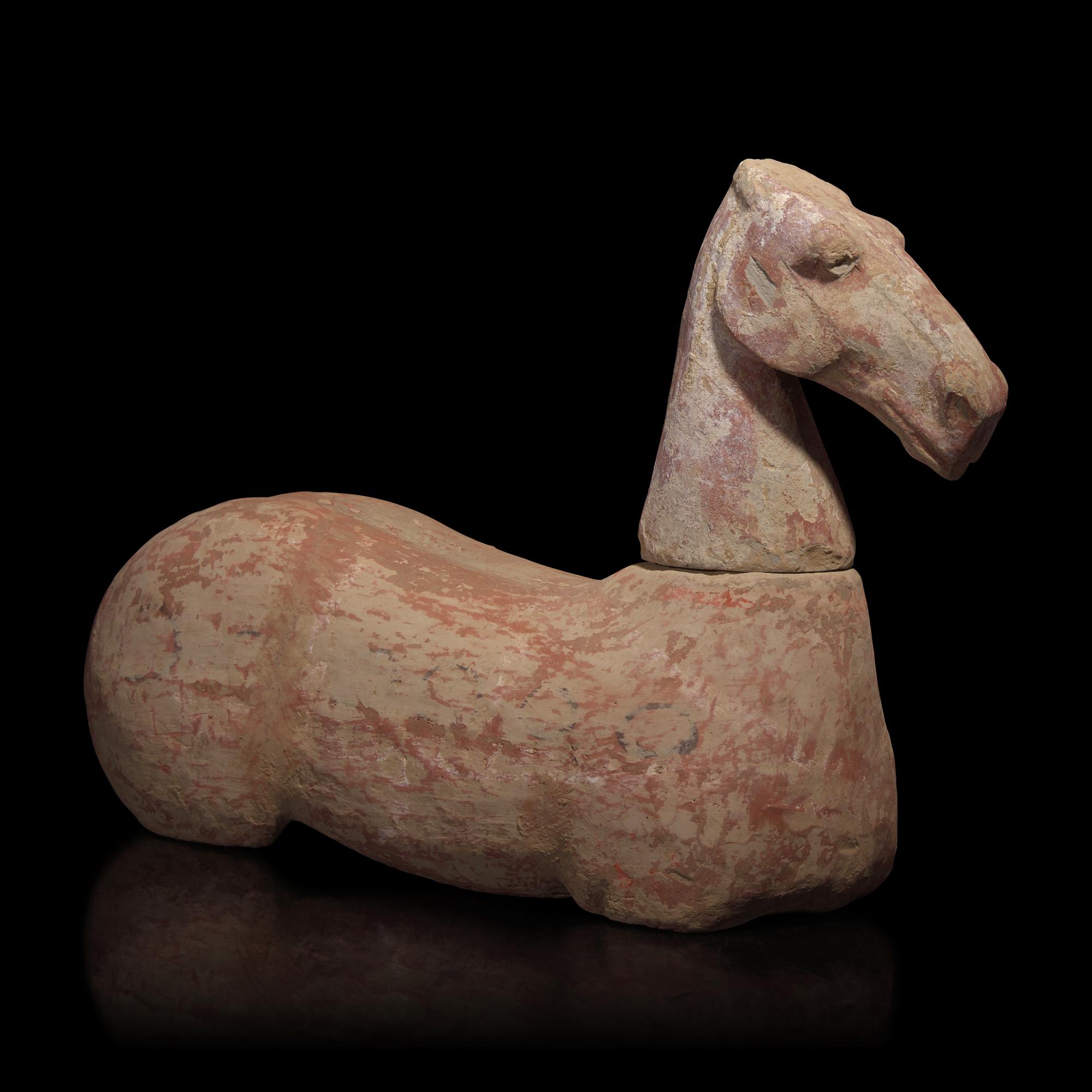 A Chinese Pottery Figure of a Recumbent Horse, Han Dynasty — 漢 彩繪灰陶馬