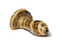 An Egyptian Charcoal and White Glass Ear Plug