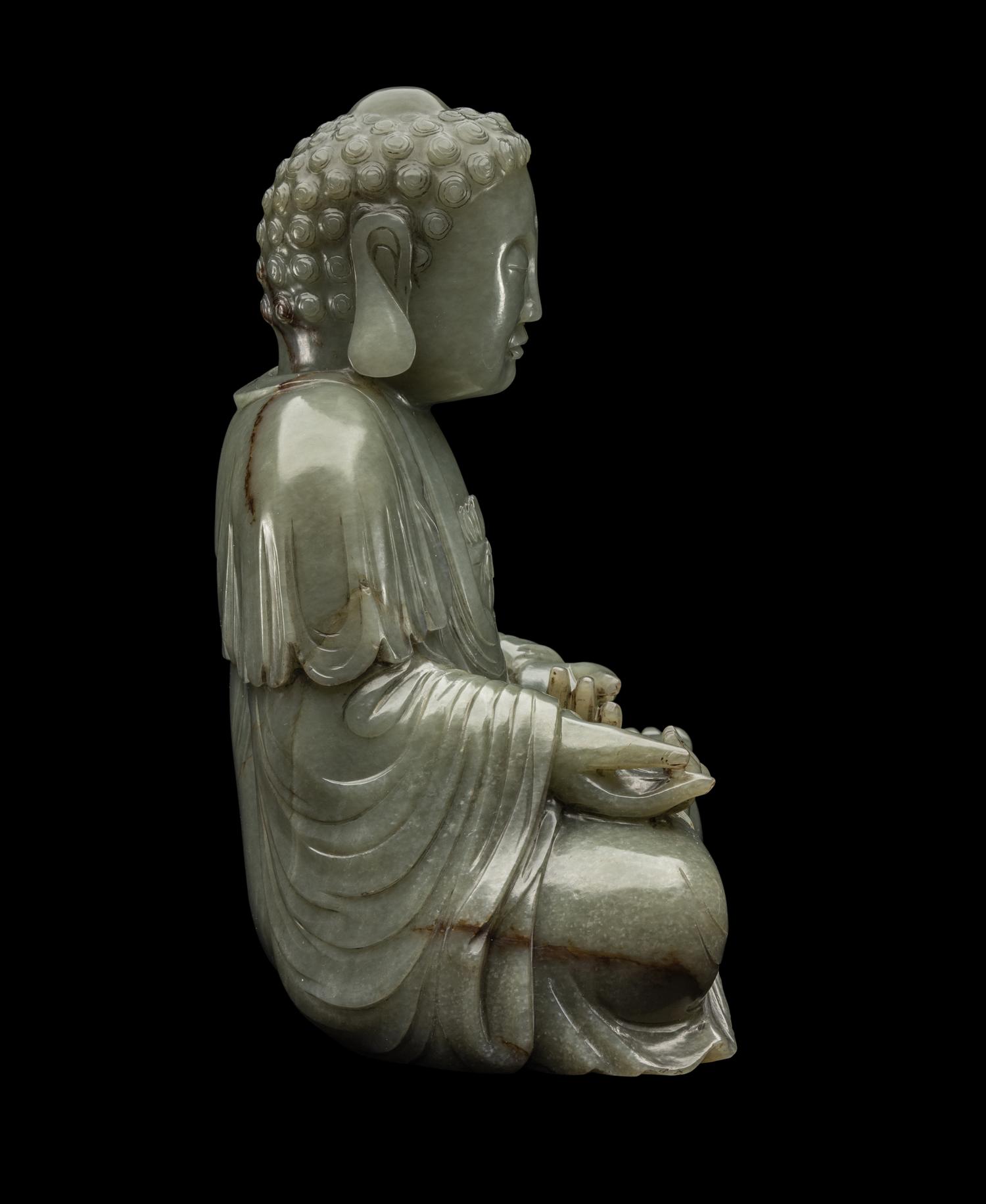 A Chinese Celadon Jade Figure of Medicine Buddha