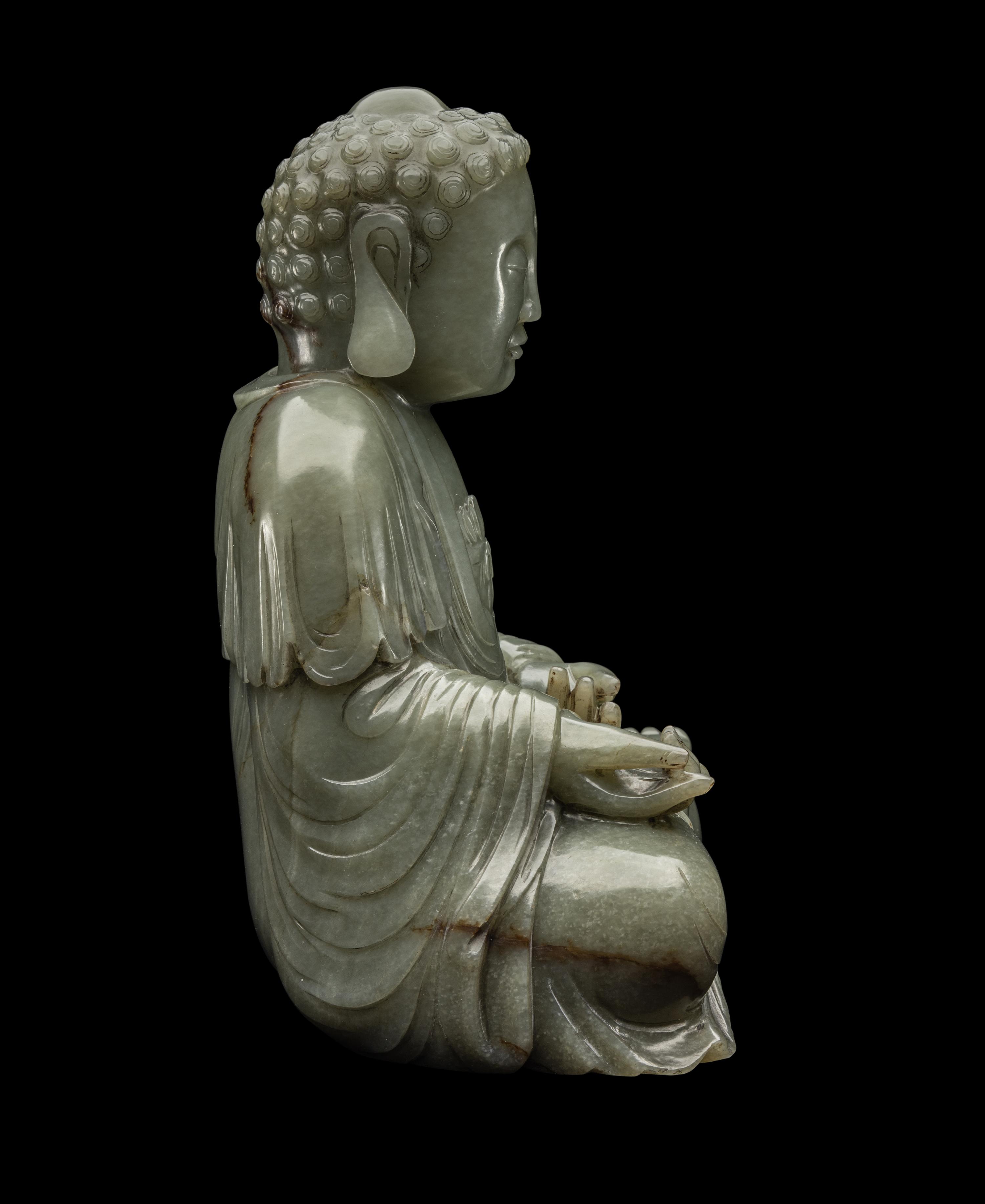 A Chinese Celadon Jade Figure of Medicine Buddha