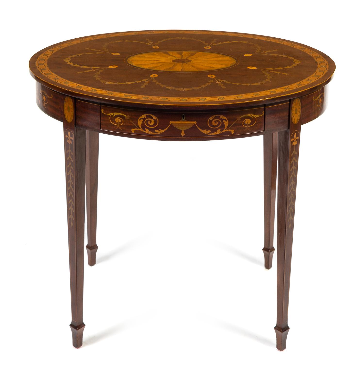 An Adam Style Marquetry Center Table Height 29 x width 38 1/2 x depth 29 inches. — LATE 19TH/EARLY 20TH CENTURY