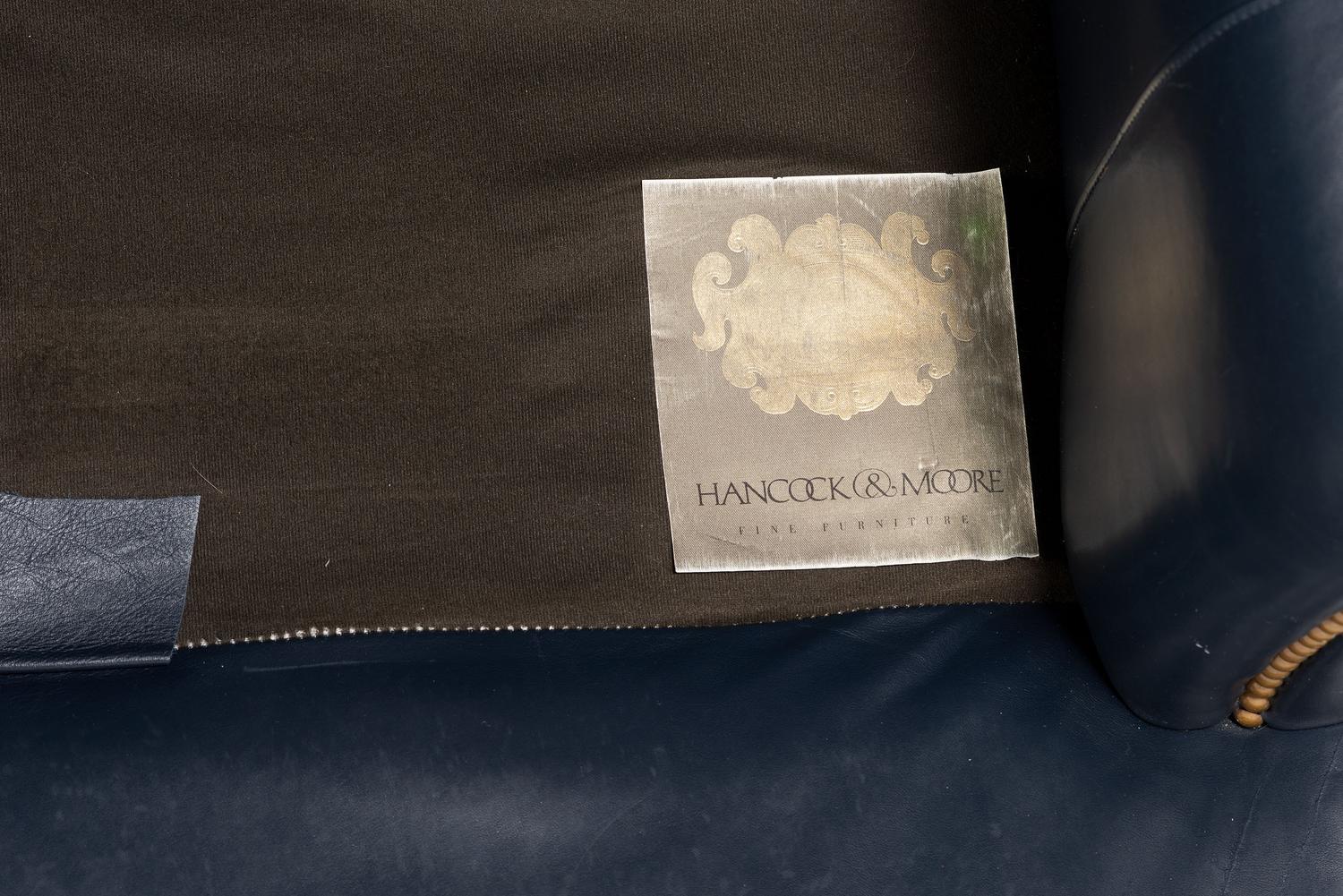 A Pair of Hancock and Moore Brass-Tacked Leather Chairs