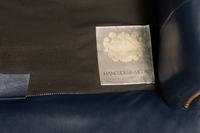 A Pair of Hancock and Moore Brass-Tacked Leather Chairs