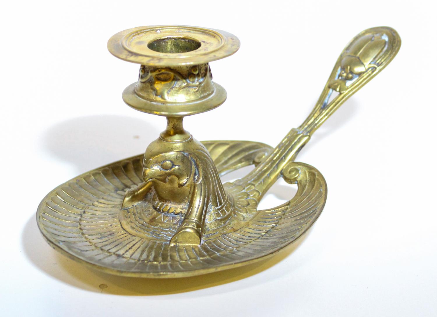 An Egyptian Revival Chamber Stick. Length 9 1/2 inches.