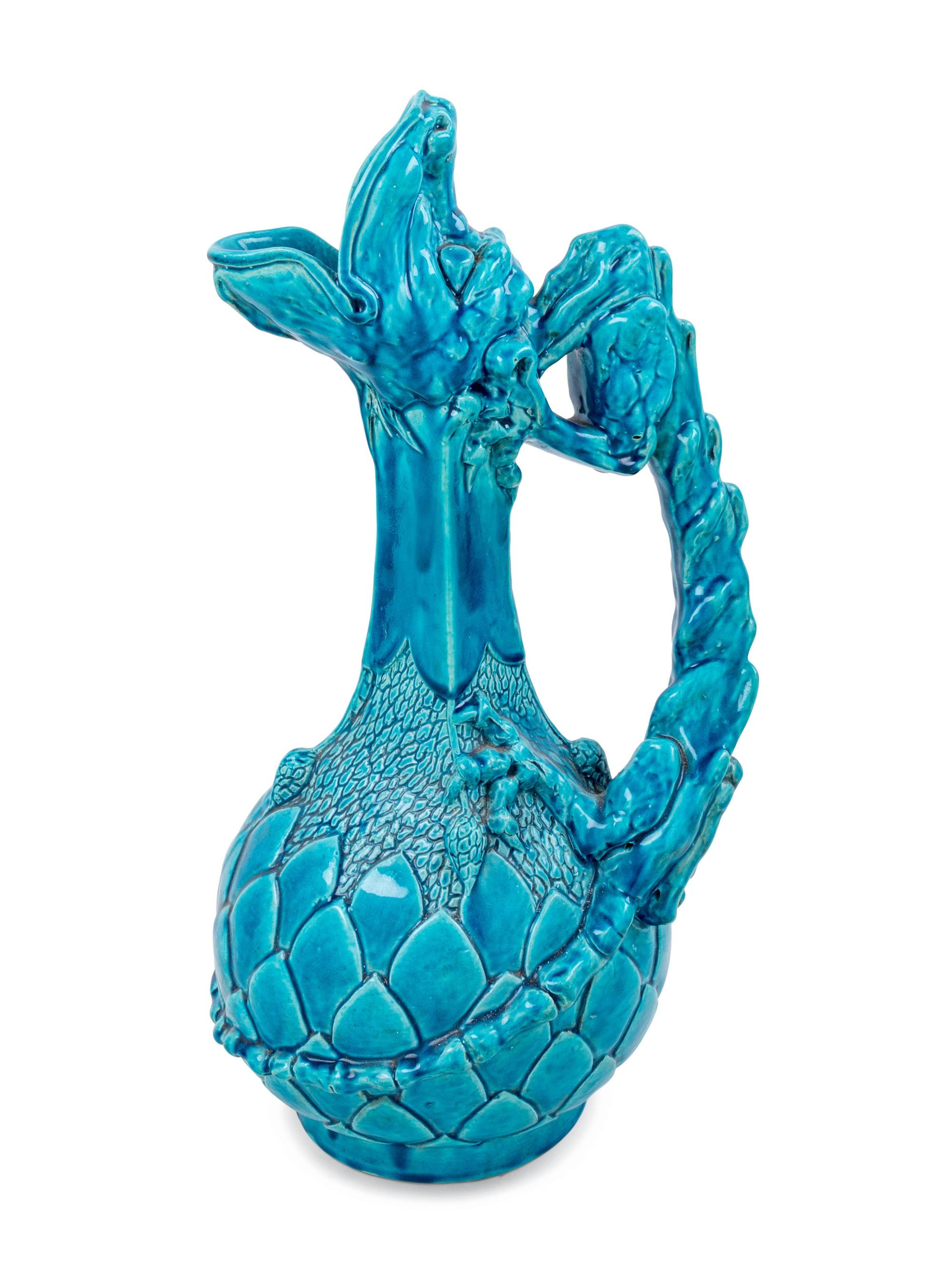 A Continental Turquoise Glazed Figural Ewer