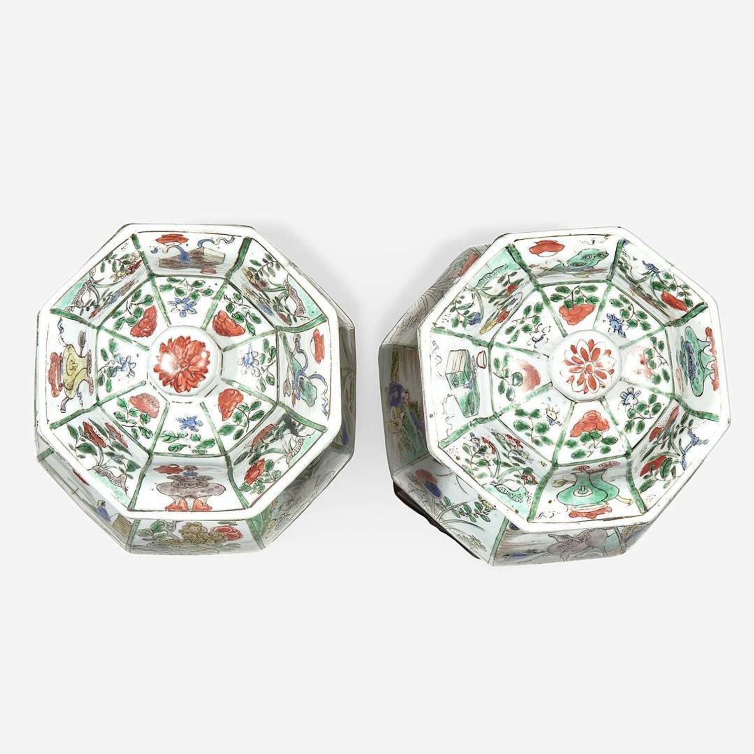 A pair of Chinese famille verte-decorated octagonal baluster vases and covers Kangxi period