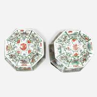 A pair of Chinese famille verte-decorated octagonal baluster vases and covers Kangxi period