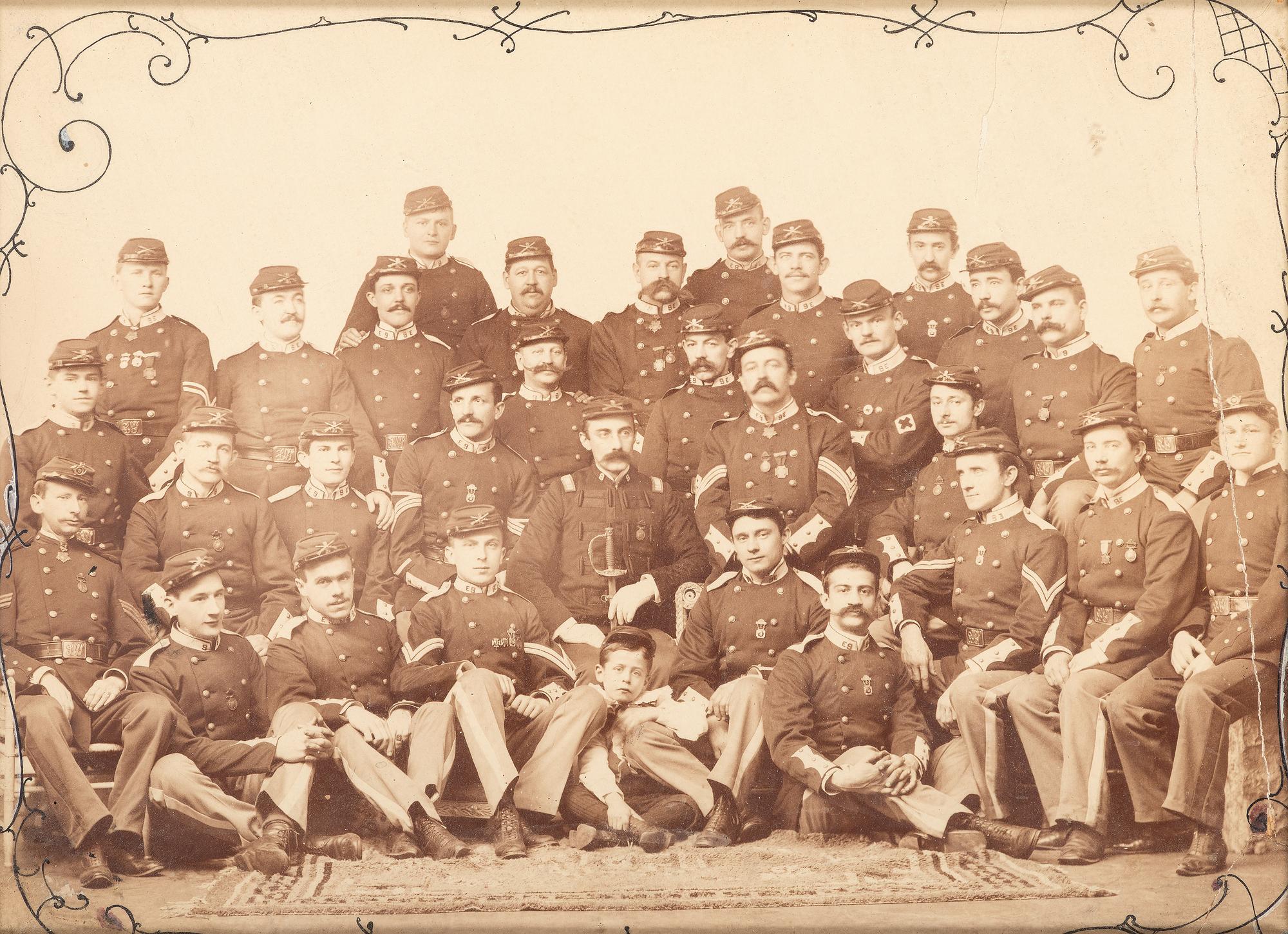 [LATE INDIAN WARS]. Studio portrait of Company E, 9th New York National Guard or Militia. [New York?]: ca 1885-1900.