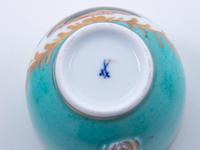 Three Meissen Painted and Parcel Gilt Porcelain Cup and Saucer Sets, a Covered Cup and Two Spoons