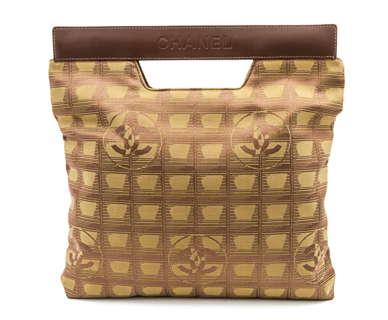 A Chanel Khaki Canvas Travel Line Bag, 11 x 11 x 1 inches.