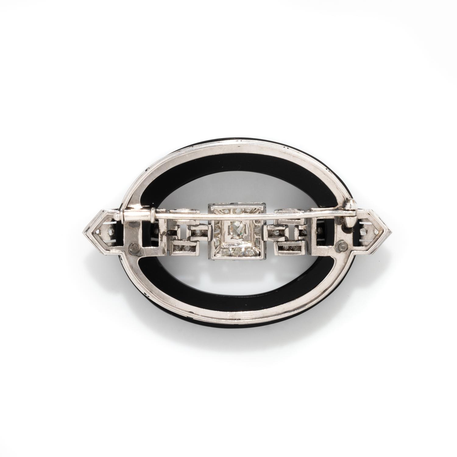 ART DECO, ONYX AND DIAMOND BUCKLE BROOCH