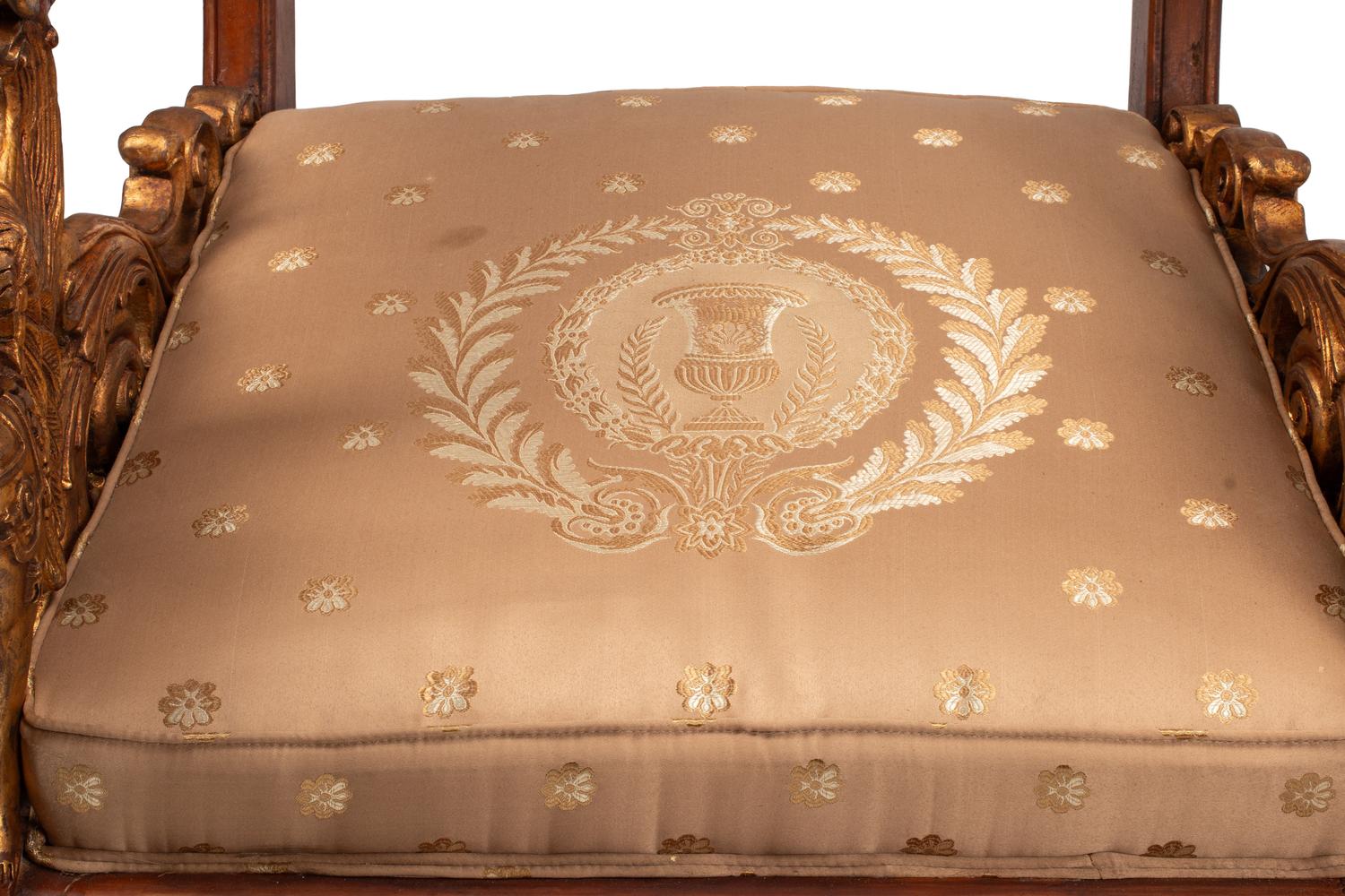 A Pair of Empire Style Parcel Gilt Walnut Armchairs
