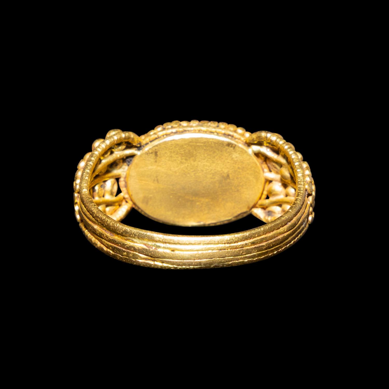A Late Roman Gold and Carnelian Ring with an Ant Carrying an Ear of Wheat