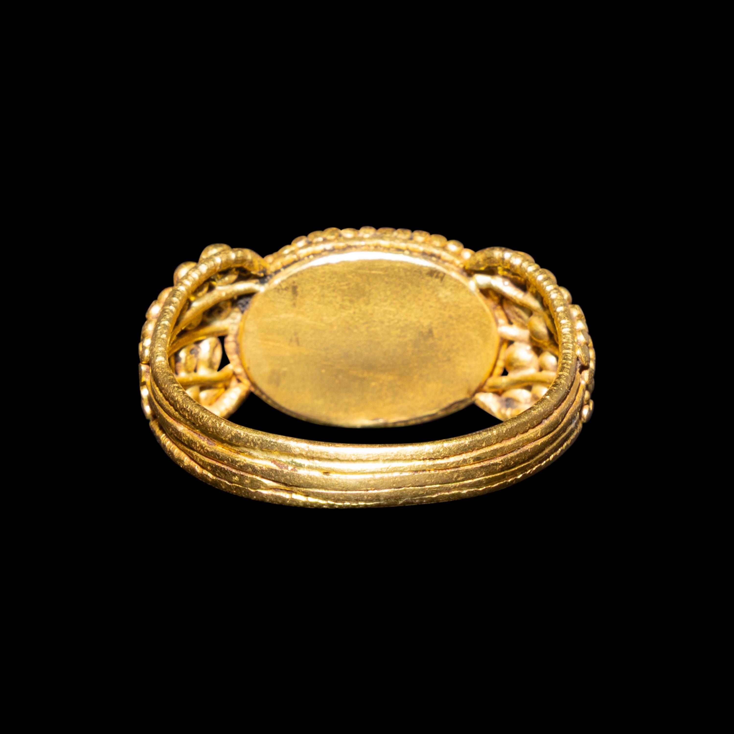 A Late Roman Gold and Carnelian Ring with an Ant Carrying an Ear of Wheat