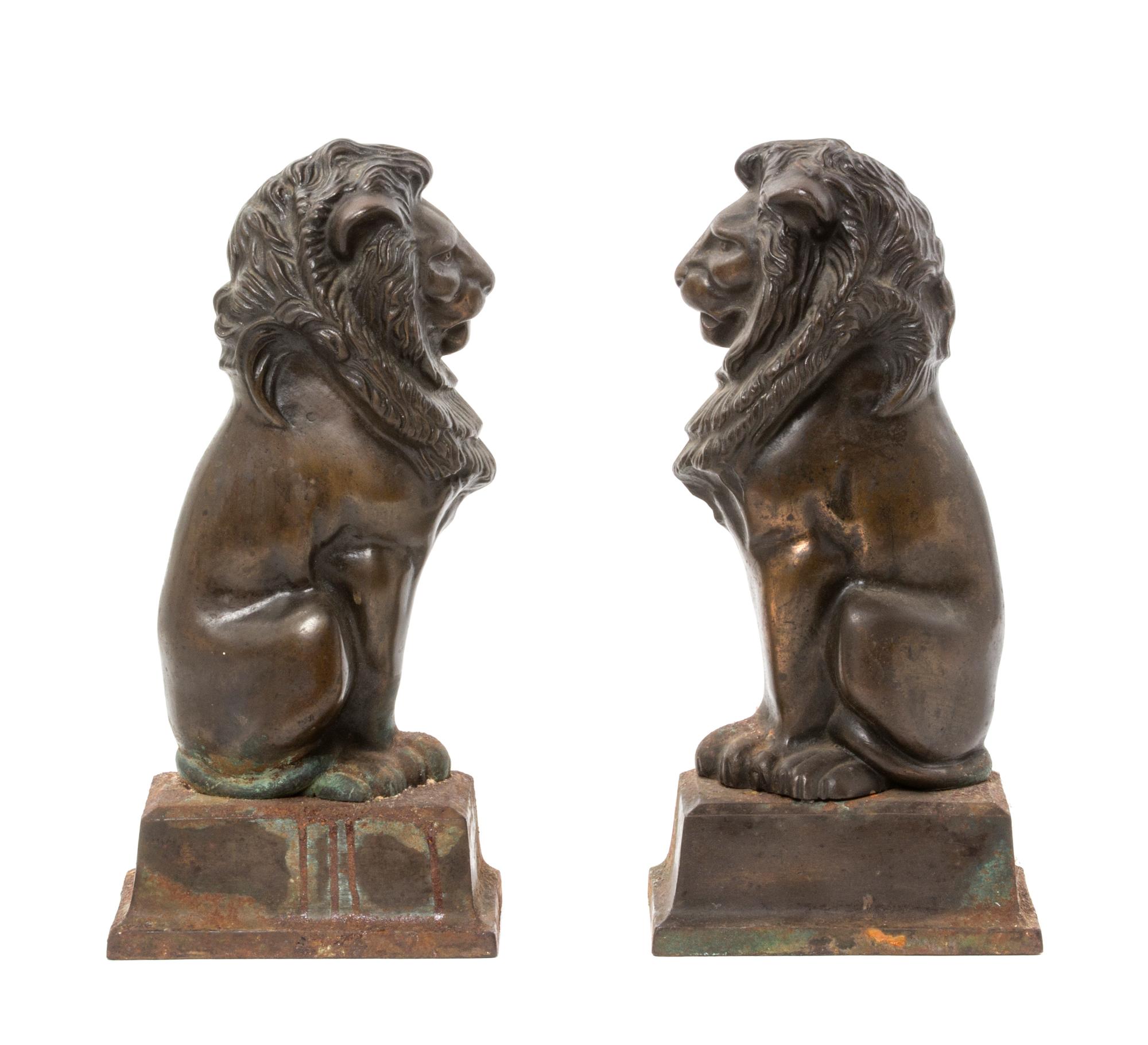 A Pair of Bronze and Iron Figural Andirons, Height 15 inches.