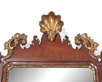 A Chippendale fret-carved and parcel-gilt looking glass, late 18th century