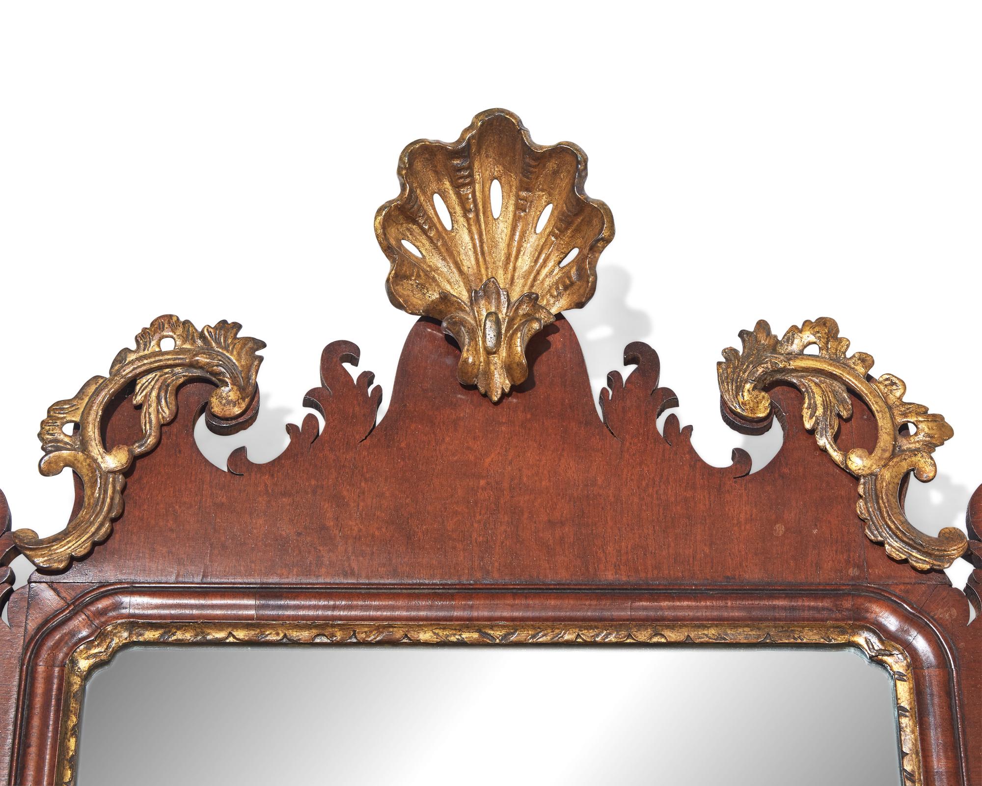 A Chippendale fret-carved and parcel-gilt looking glass, late 18th century