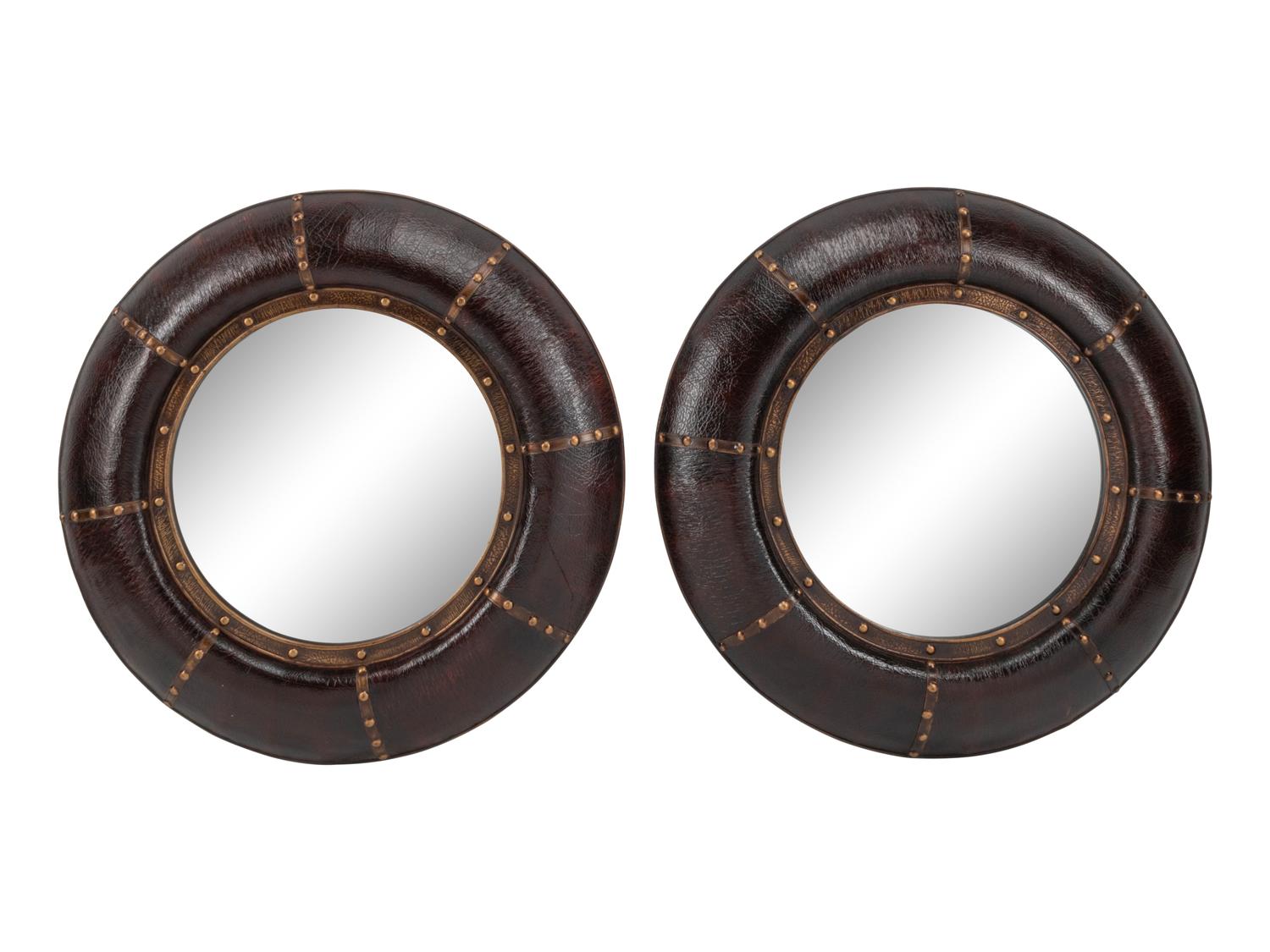 A Pair of Portuguese Style Embossed Leather Circular Mirrors