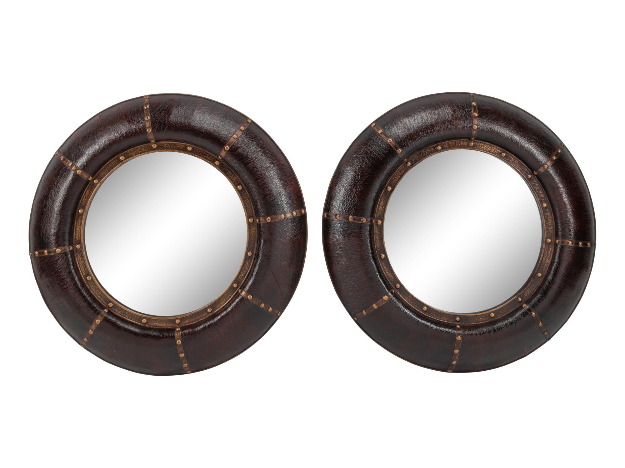 A Pair of Portuguese Style Embossed Leather Circular Mirrors