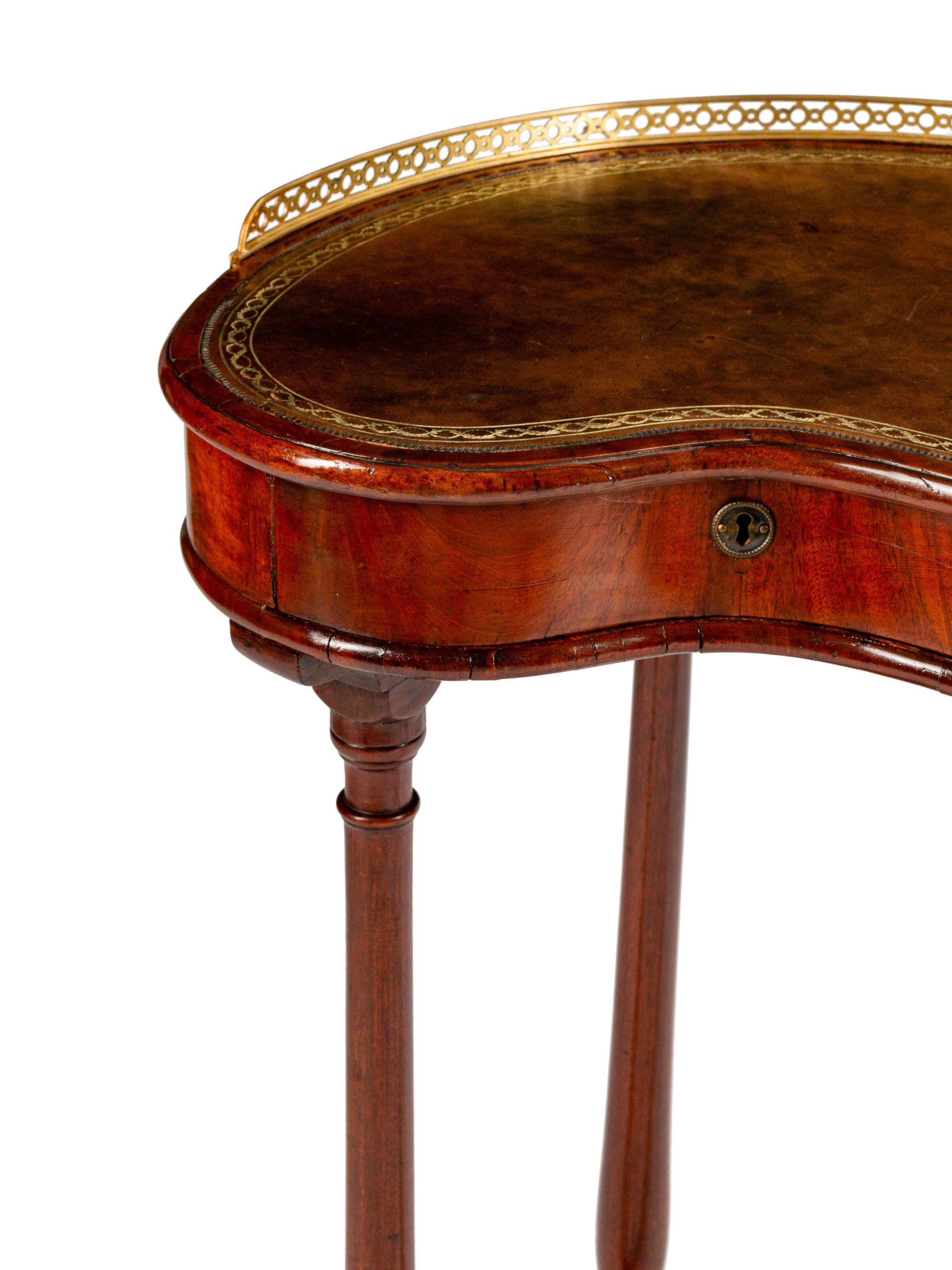 An English Brass-Mounted Mahogany Kidney-Shaped Reading Table — 19TH CENTURY