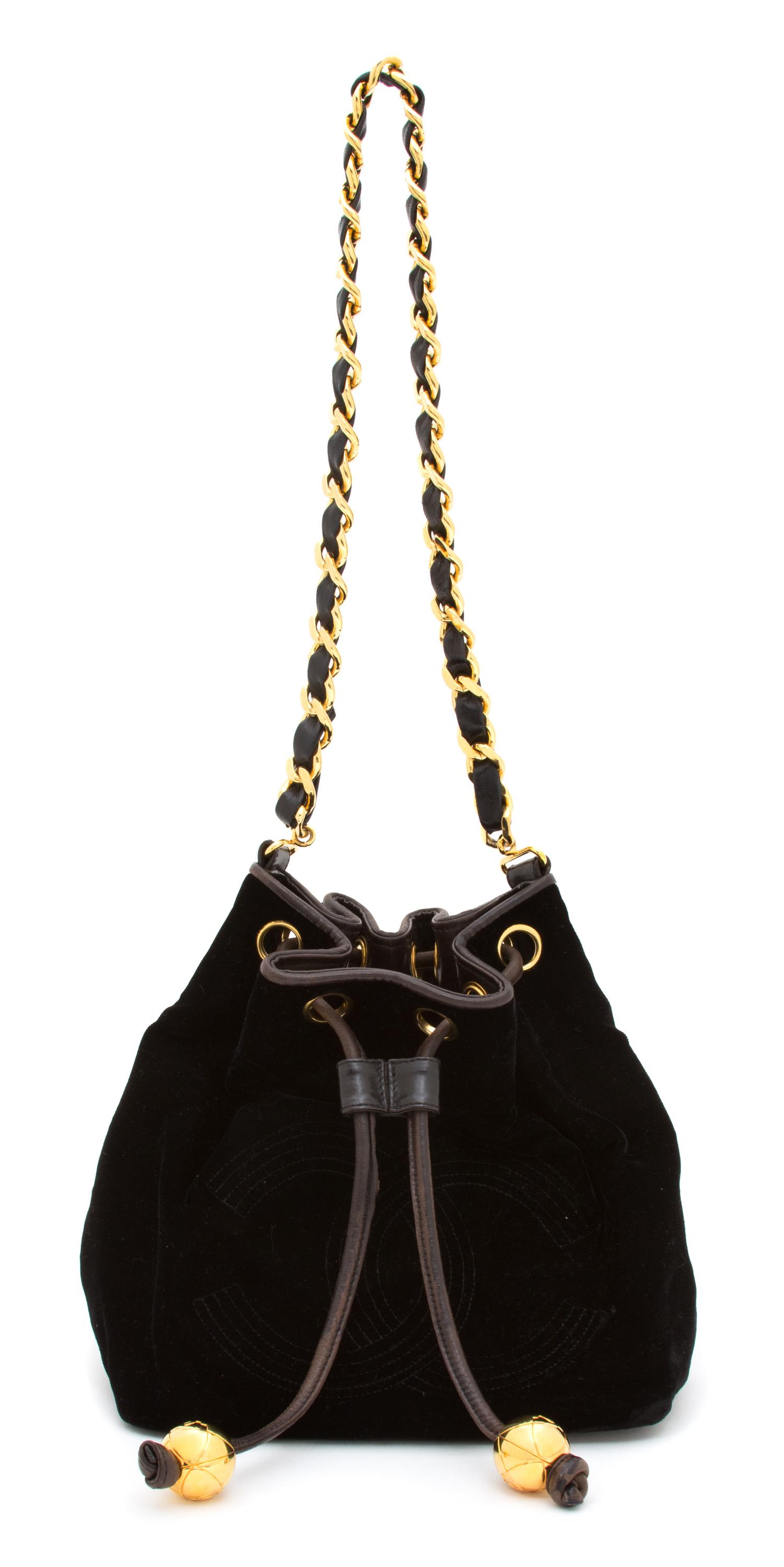 A Chanel Black Velvet Drawstring Bag, 8.5" x 8.25" x 5.75"; Strap drop: 12.25".