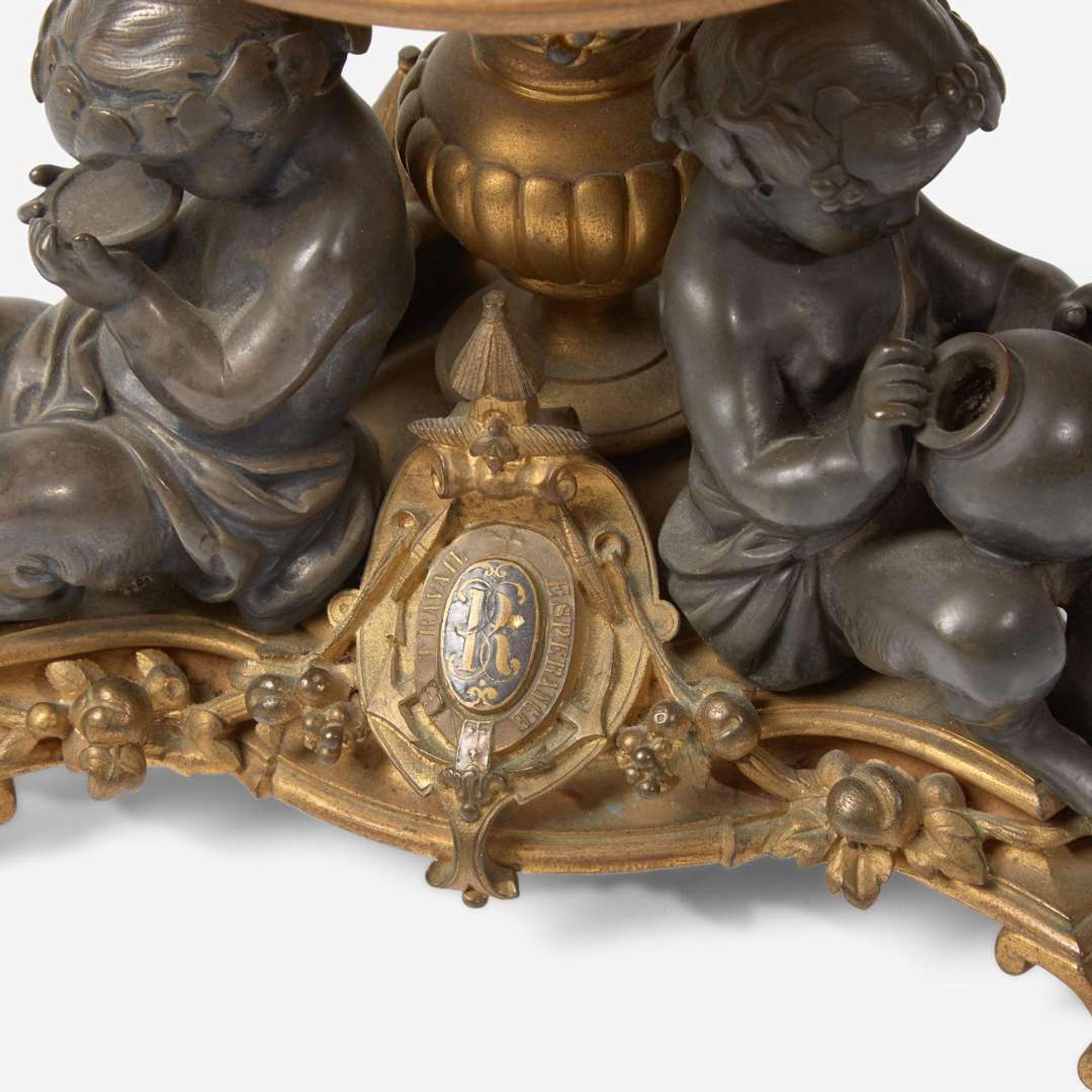 A pair of French Napoleon III patinated and gilt bronze tazza with fauns Bearing marks for Henri Picard (French, active 1831-1864), late 19th century