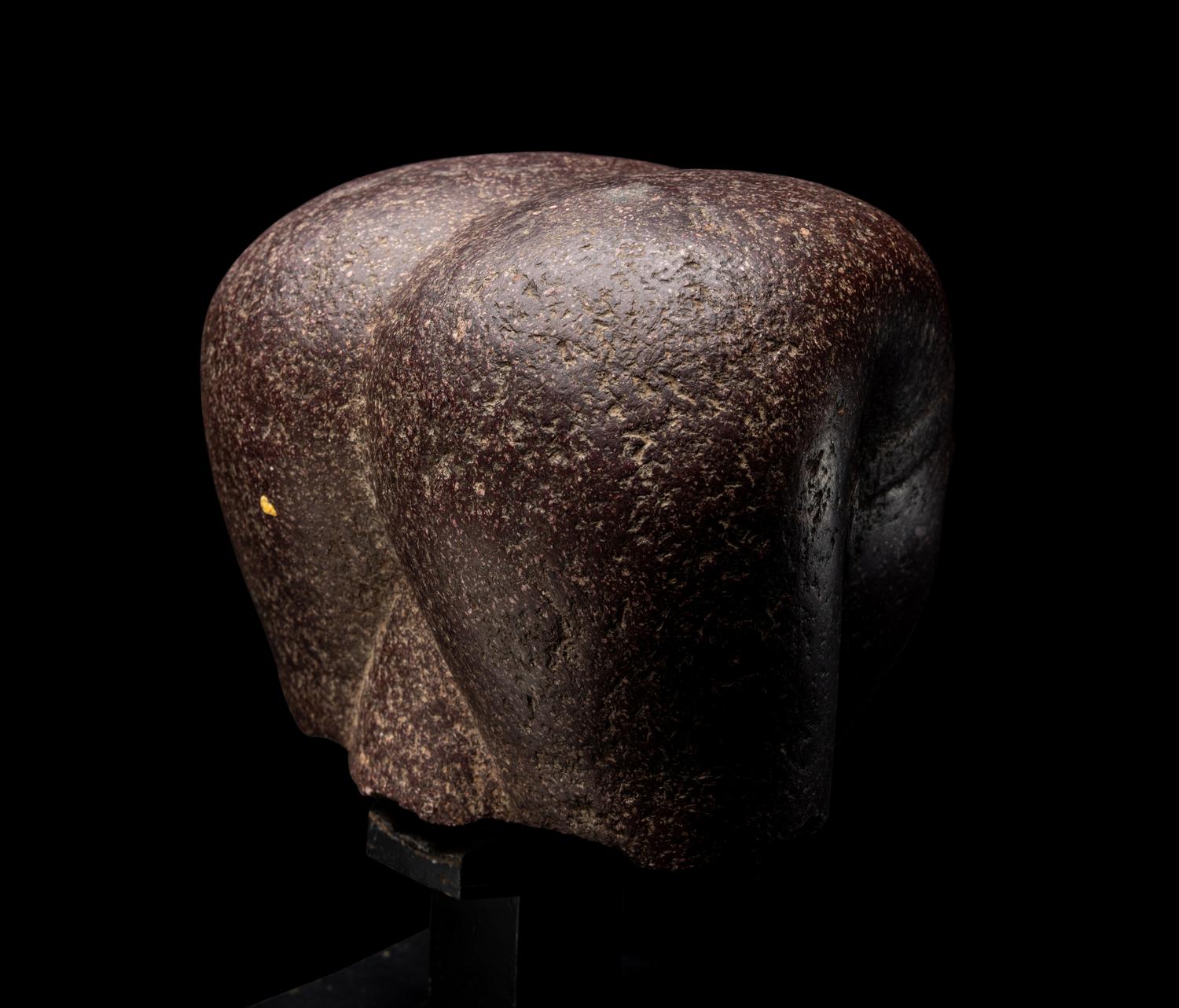 A Roman Porphyry Head of an Egyptian Woman