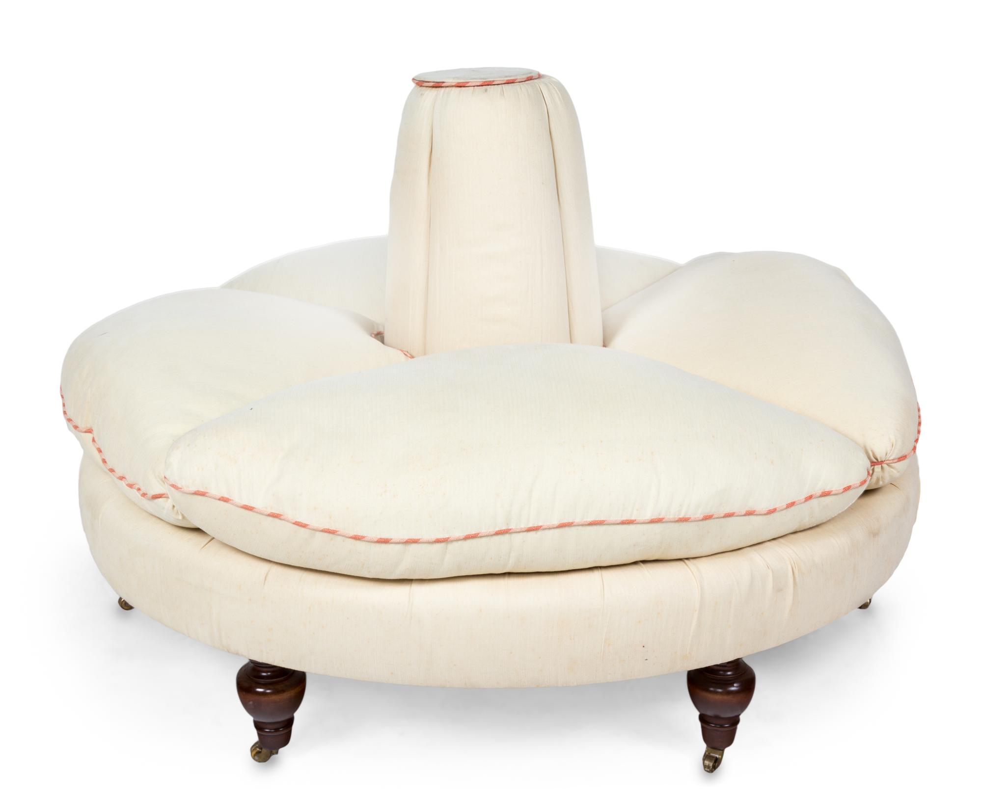 A Victorian Style Mahogany and Upholstered Confidante Height 34 x diameter 58 inches. — 20TH CENTURY