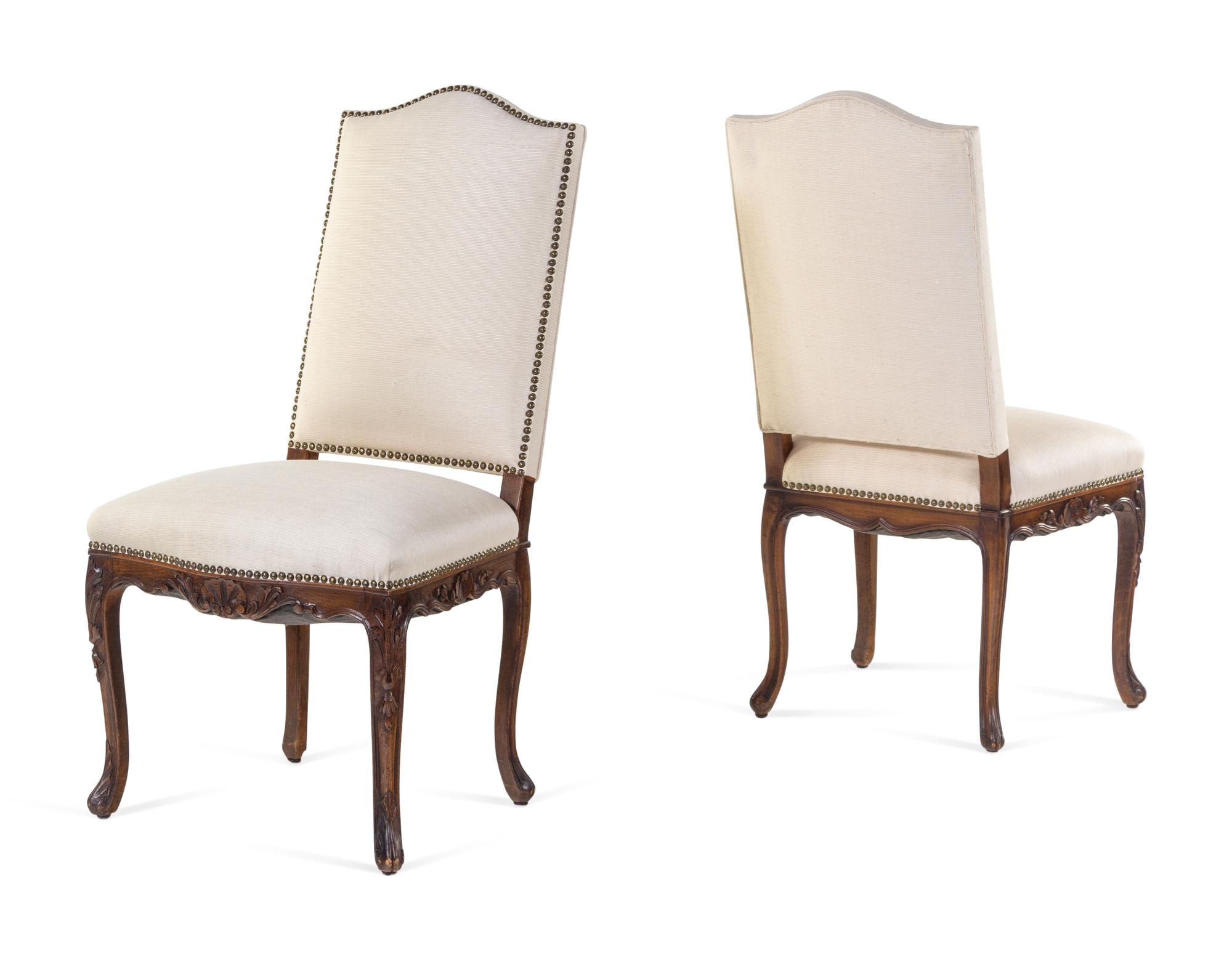 A Pair of Louis XV Style Carved Walnut Side Chairs