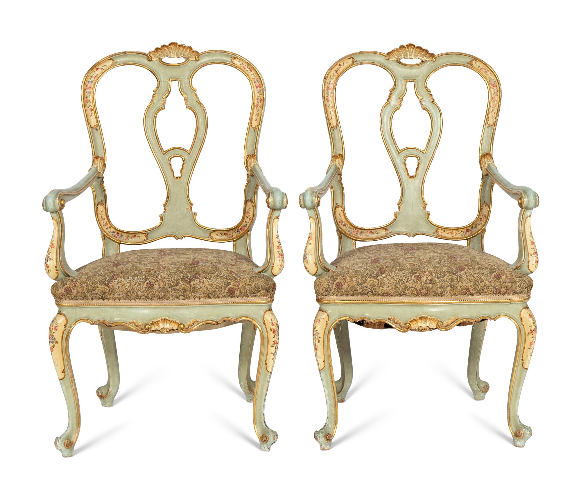 A Pair of Italian Rococo Style Painted and Parcel Gilt Armchairs