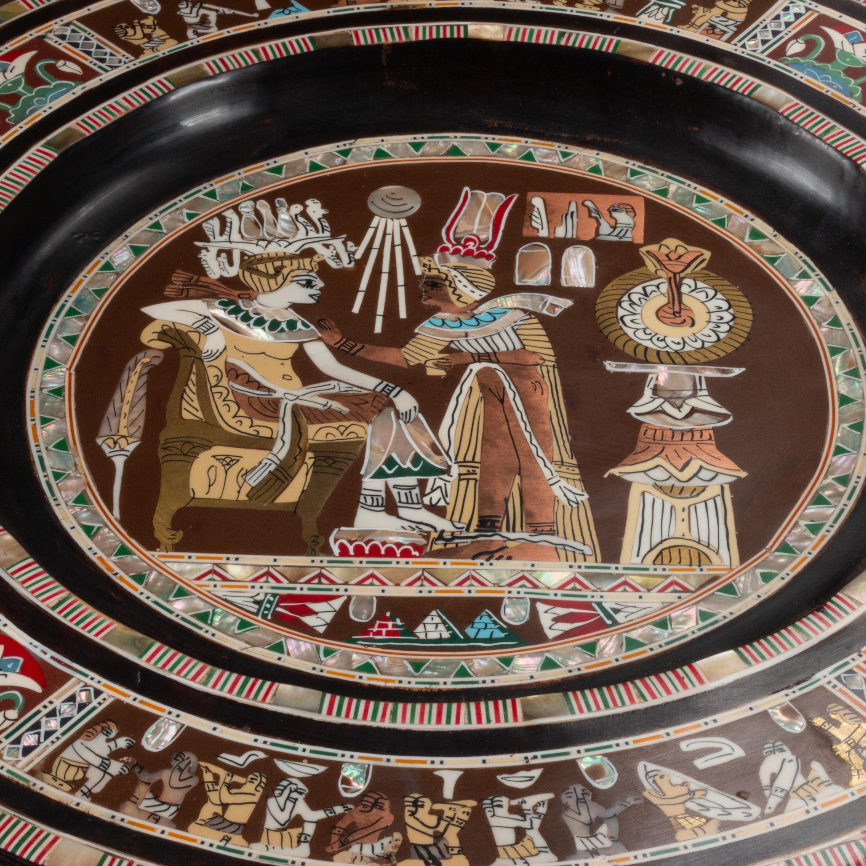 A Pair of Patinated Bronze Egyptian Figures with Marquetry Trays