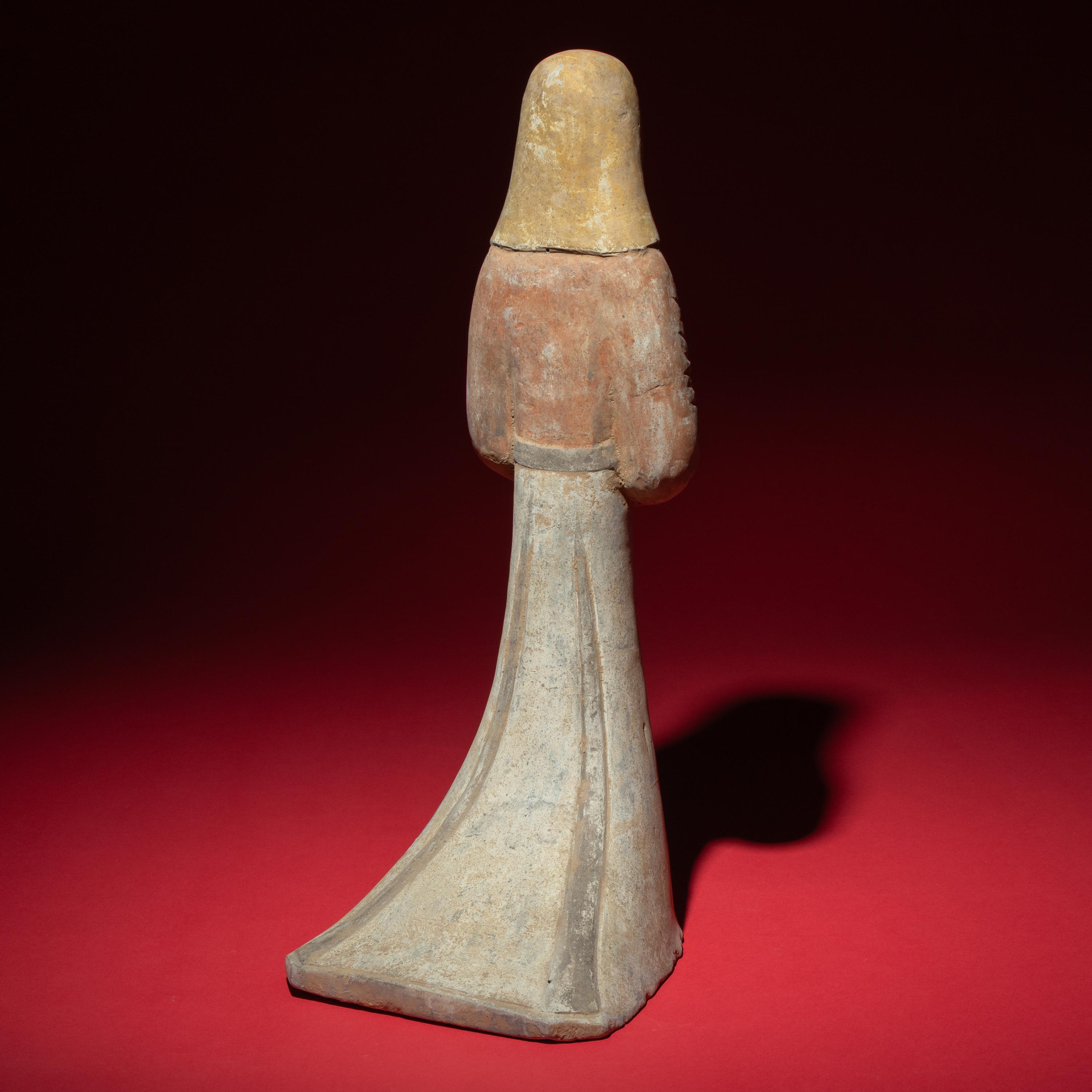 A Large Chinese Painted Pottery Standing Lady Wearing a Hood, Han Dynasty — 漢 大型灰陶彩繪風帽喇叭裙女俑