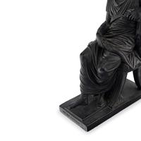 A Pair of Black Earthenware or Composition Figures