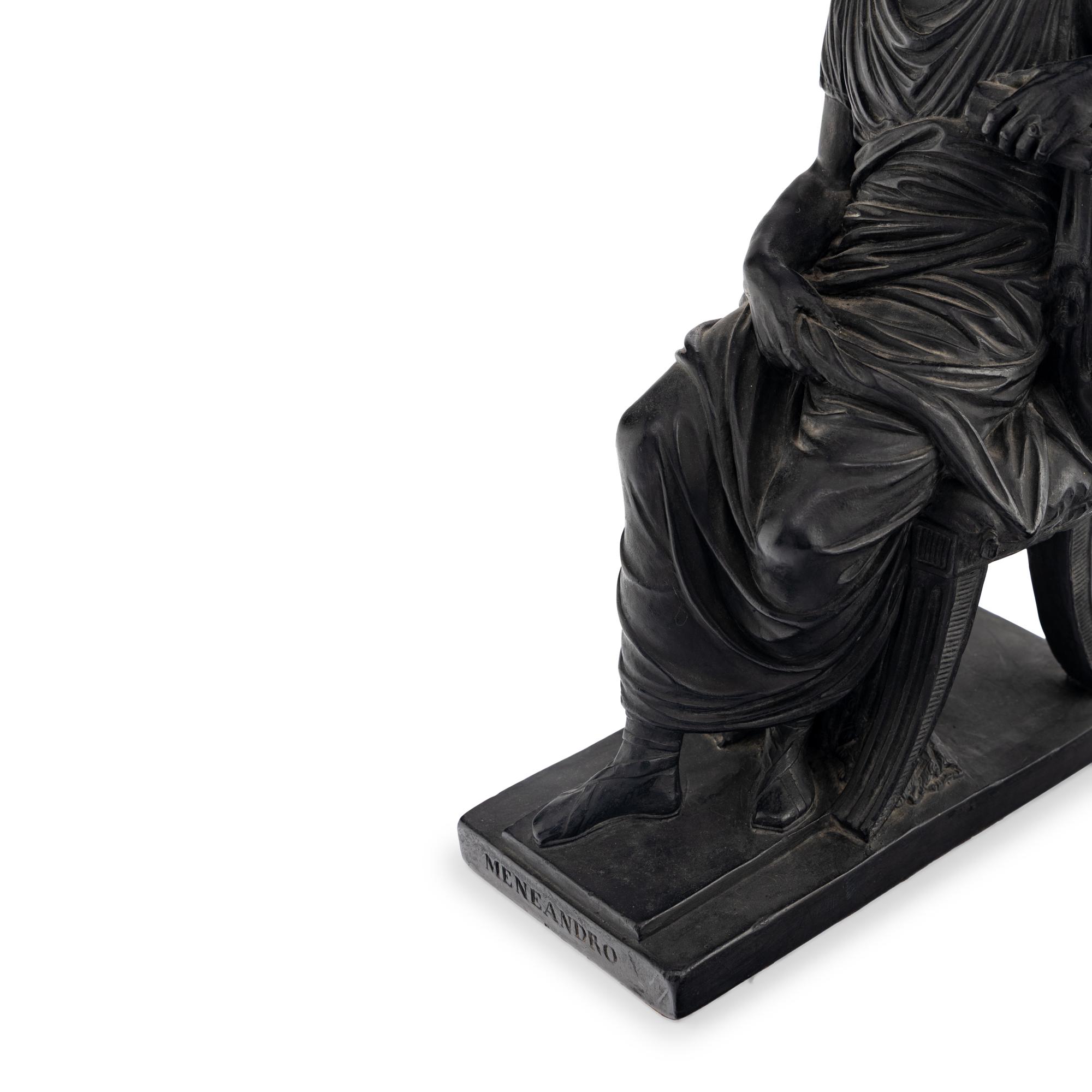 A Pair of Black Earthenware or Composition Figures