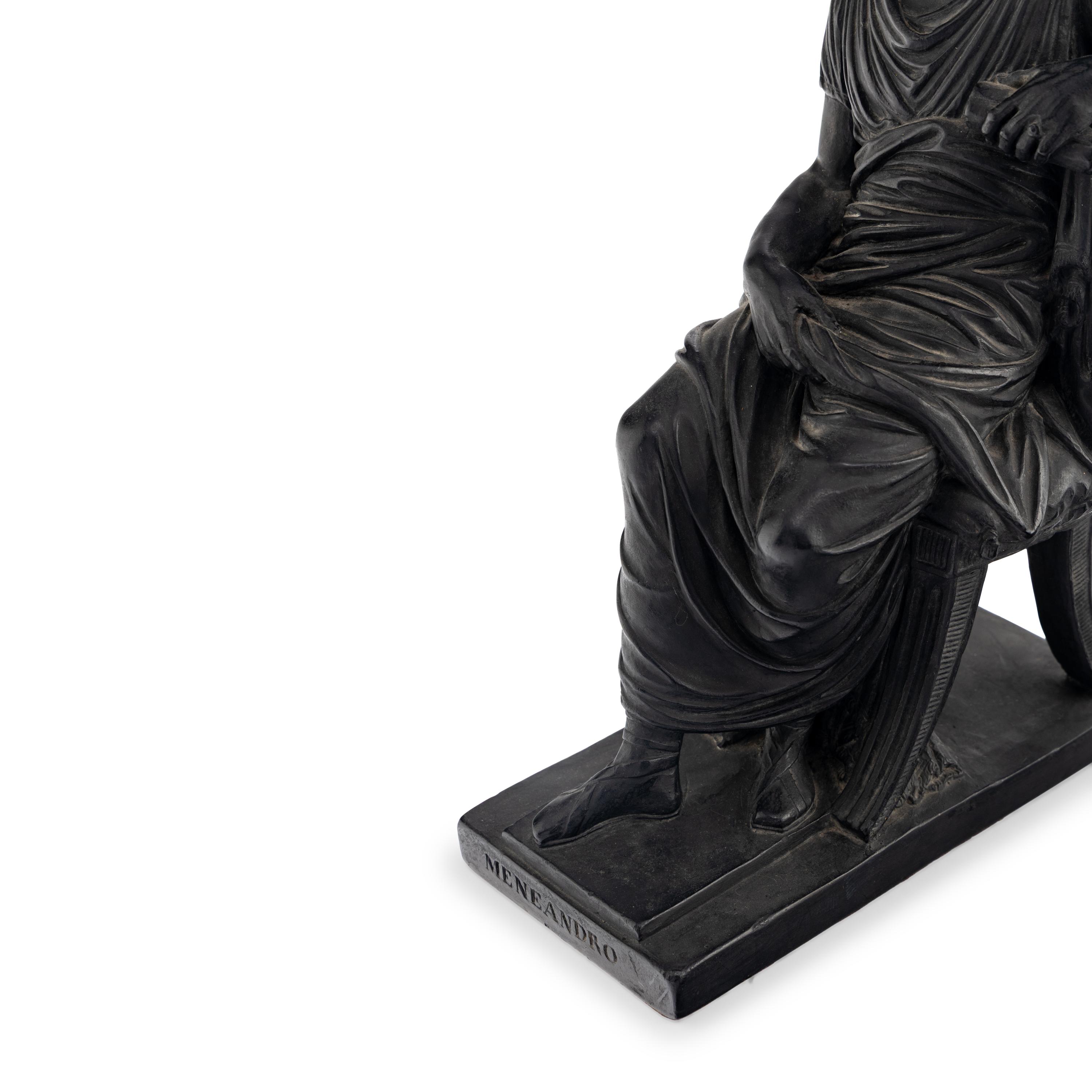 A Pair of Black Earthenware or Composition Figures
