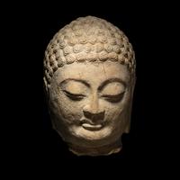 A Carved Stone Head of Buddha