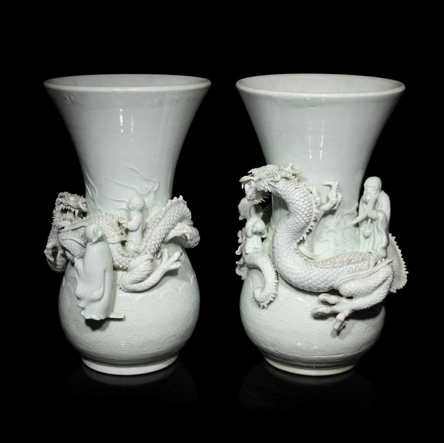 A Pair of Japanese Hirado Molded White Glazed Porcelain Vases, Meiji Period 明治時期 日本鍋島燒白釉龍紋瓶一對