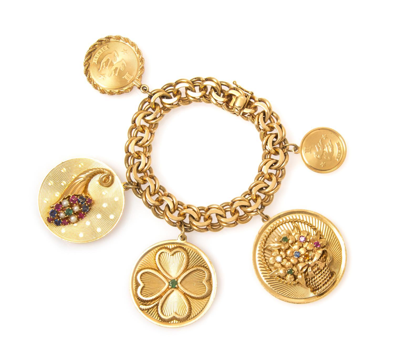 A 14 Karat Yellow Gold Charm Bracelet with Five Attached Charms, 57.90 dwts.