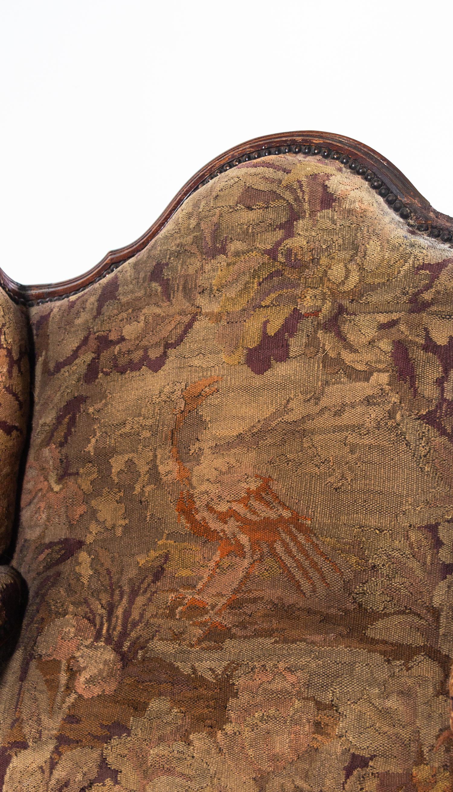 A Louis XV Style Walnut Tapestry-Upholstered Bergère