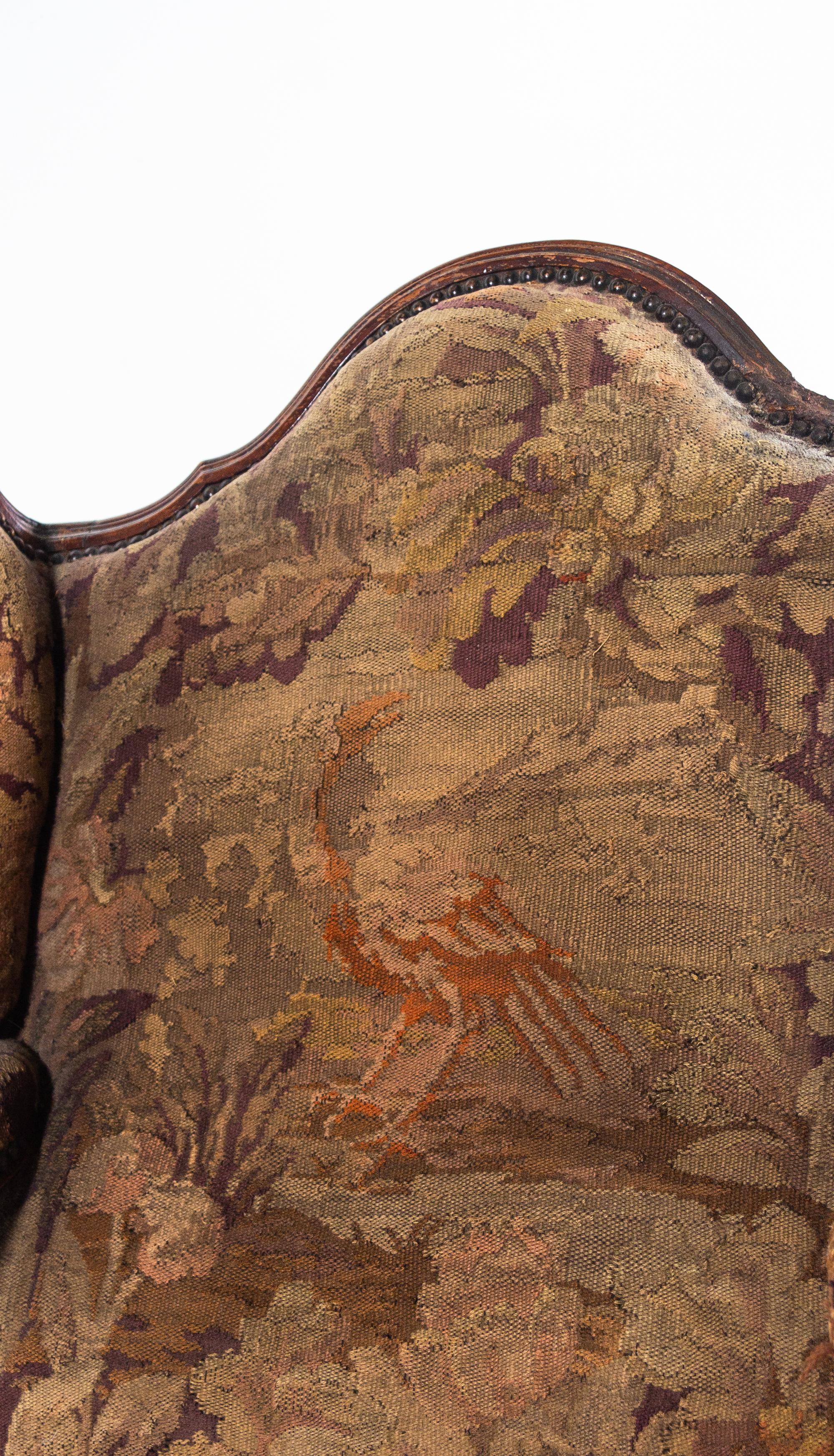 A Louis XV Style Walnut Tapestry-Upholstered Bergère